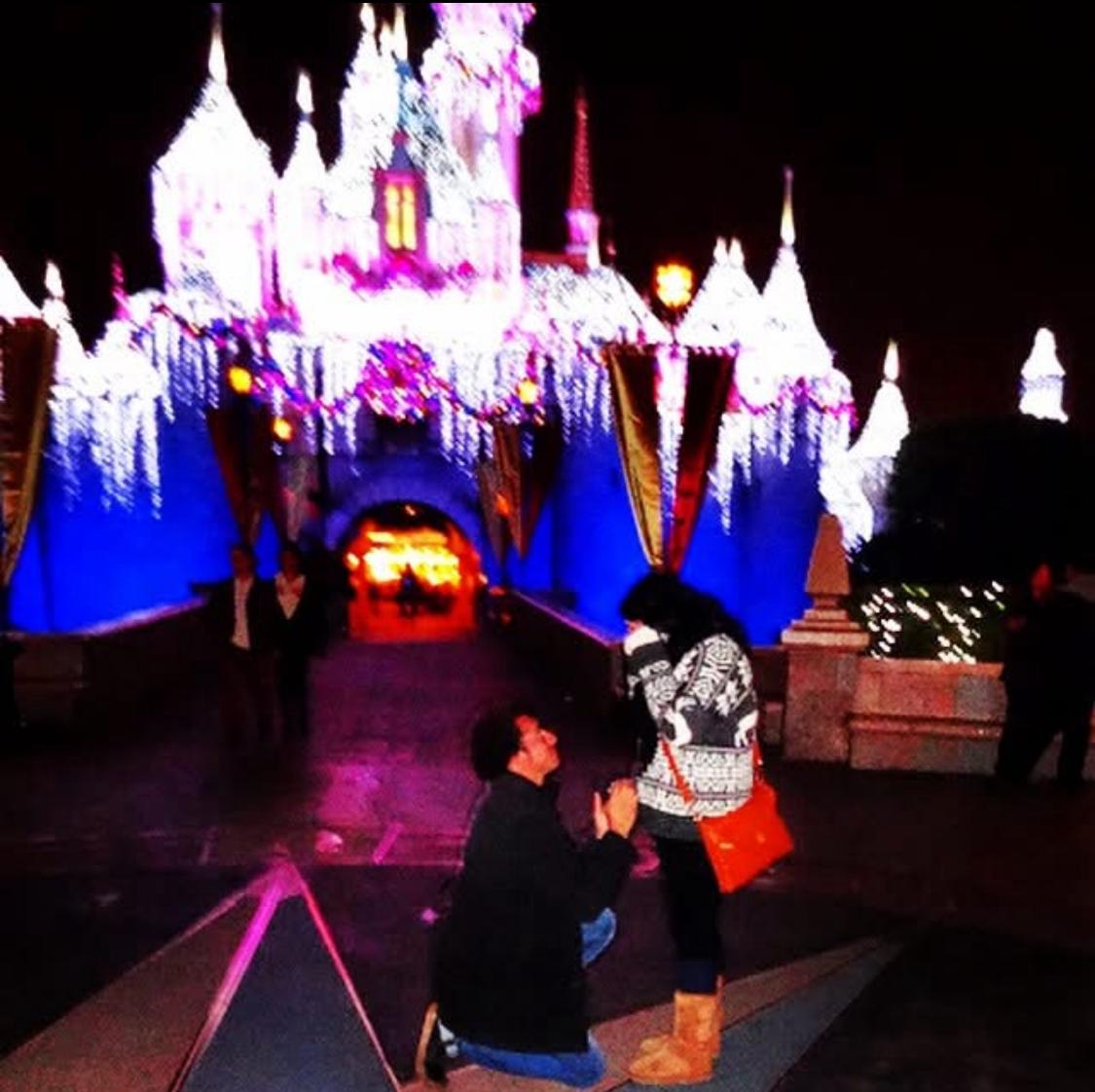 In 2013, Anne Chester's then-fiance proposed in front of Cinderella's Castle at midnight on Christmas. They had just gone on the Peter Pan ride together, which holds sentimental value for them both. The castle in the background is decorated in lights intended to look like icicles, a holiday special
