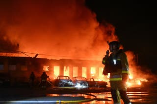 Firefighters work at the Russian attack on a Russian attack on a private company at a Russian attack on Ukraine.
