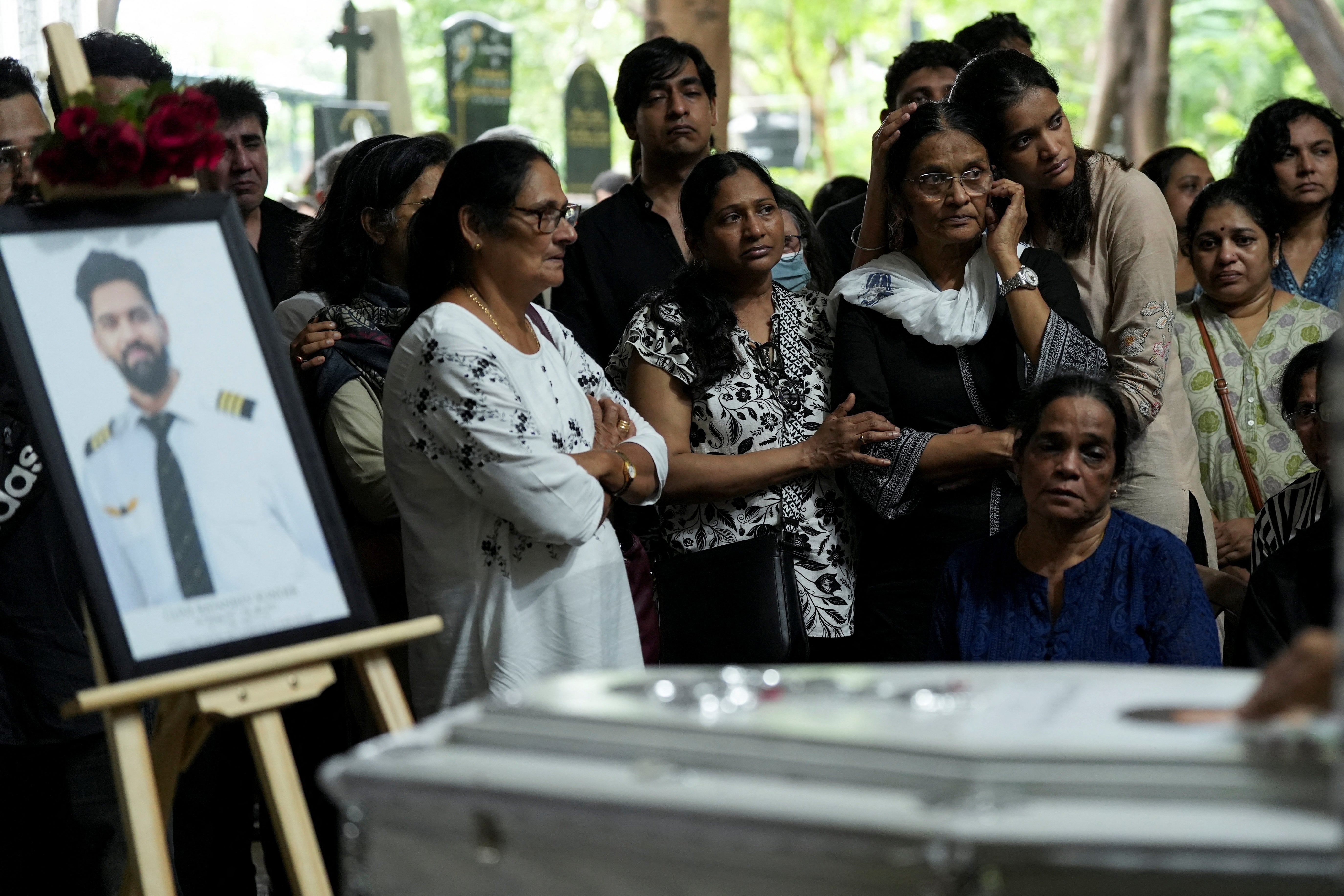 Friends and family members mourn near the coffin of co-pilot Clive Kunder, who died after an Air India Boeing 787-8 Dreamliner plane crashed during take-off from an airport in Ahmedabad, in Mumbai, India June 19, 2025