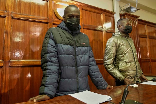 <p>Kenya police officers Duncan Kiprono, left, and Baraza Masinde, right, accused of assaulting and shooting hawker Boniface Mwangi Kariuki during a protest, appear at the Milimani Law Courts in Nairobi</p>