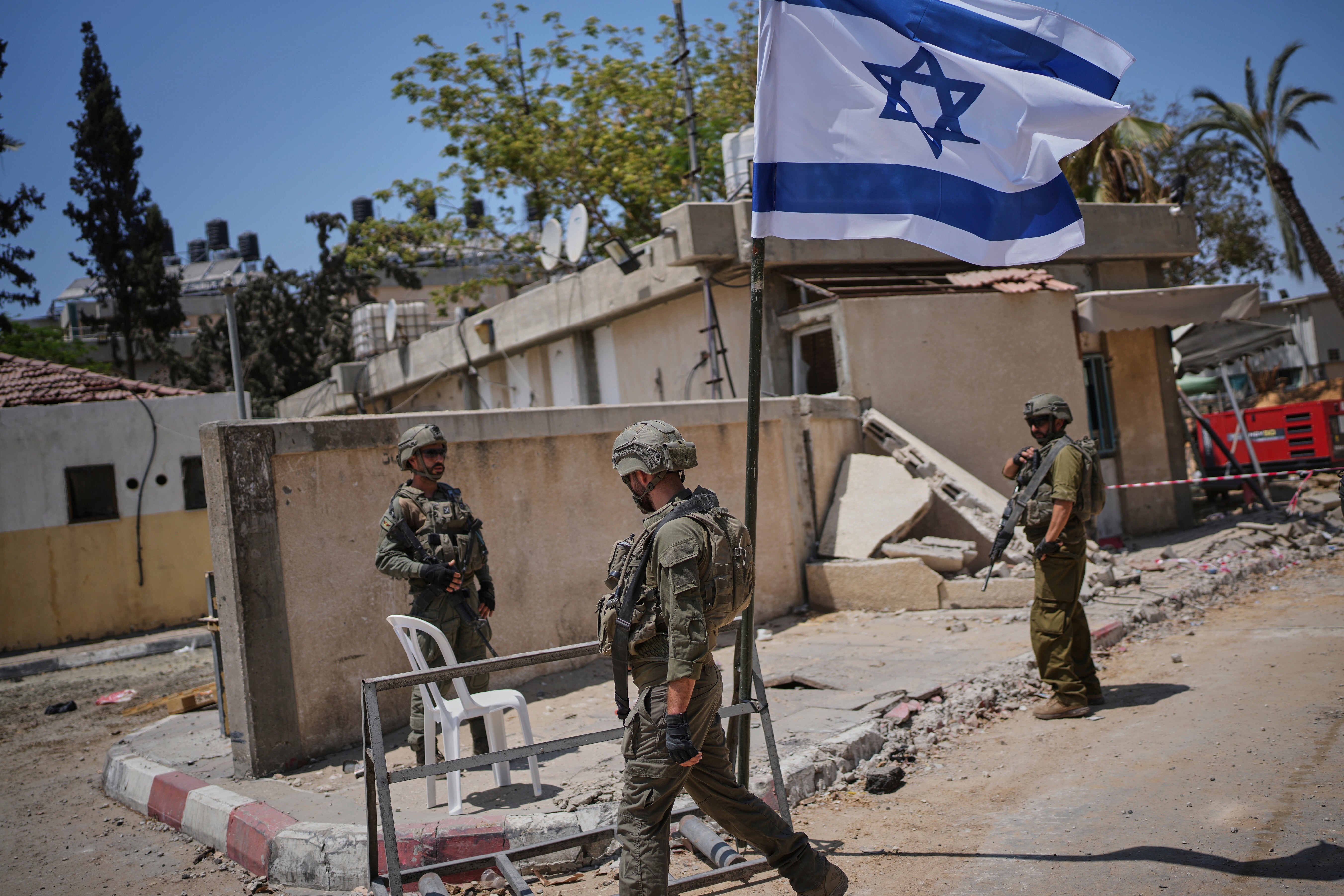 Israeli soldiers take up position at the European Hospital in Khan Younis, southern Gaza, where the military claims that Hamas militants operated in a tunnel beneath the facility, on June 8, 2025