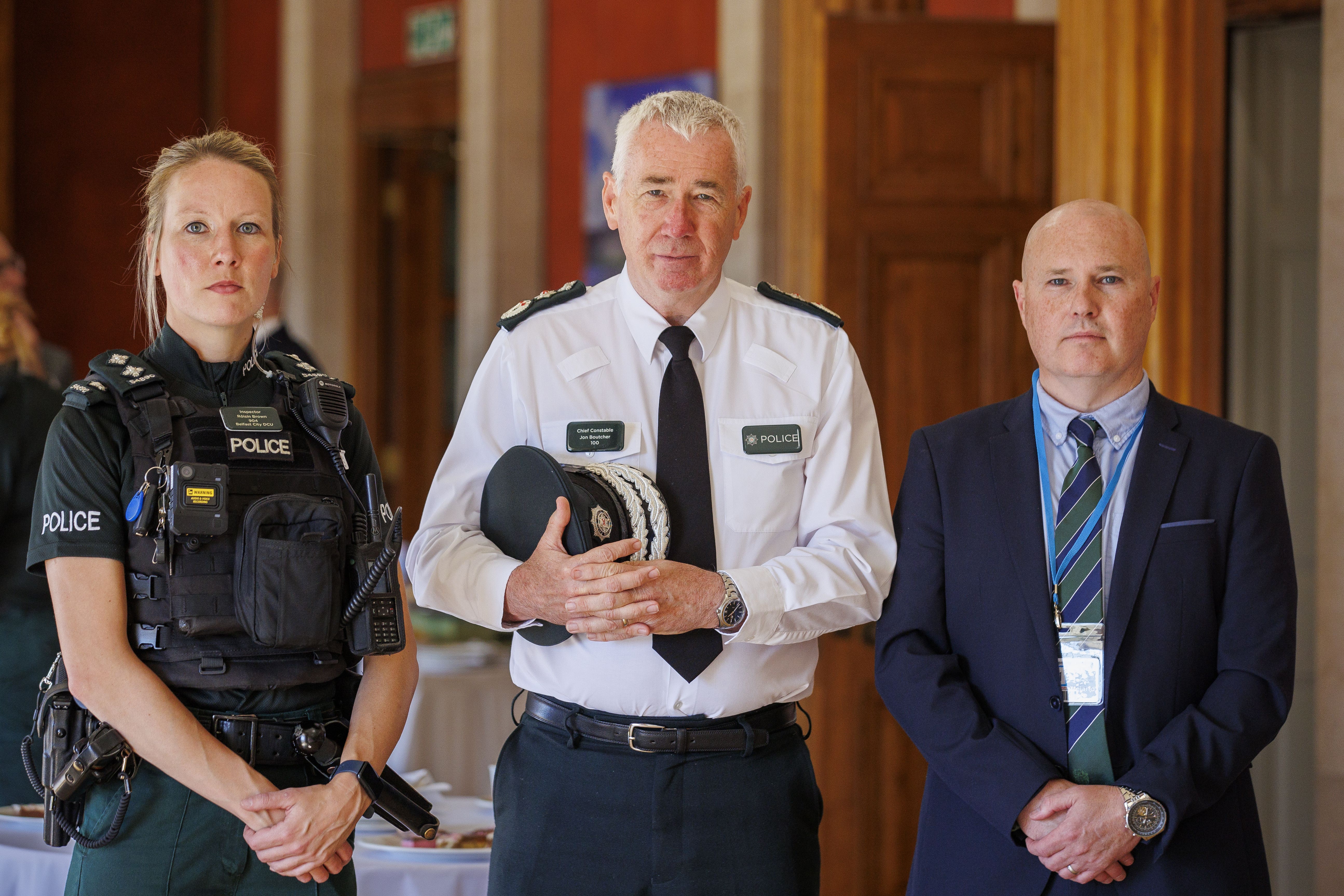 Inspector Roisin Brown, PSNI Chief Constable Jon Boutcher and Sgt Mark Young during a Police Federation of Northern Ireland event in the Long Gallery of the Parliament Buildings at Stormont (Liam McBurney/PA)