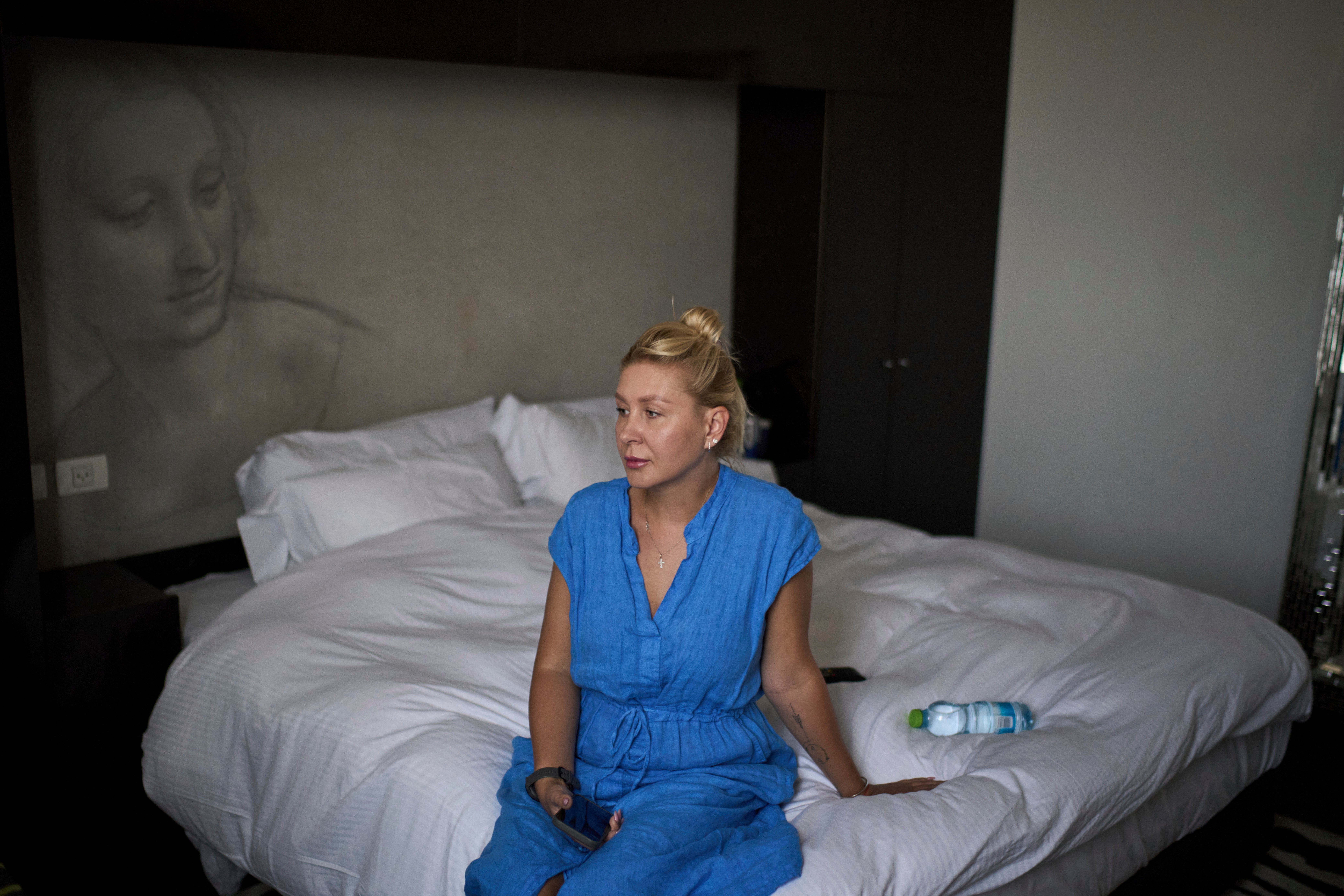 Ukrainian makeup artist Tetiana Kurakova, 40, sits in a hotel in Tel Aviv, Israel, June 17, 2025, that was turned into a shelter for evacuees from Bat Yam, which was hit by an Iranian strike