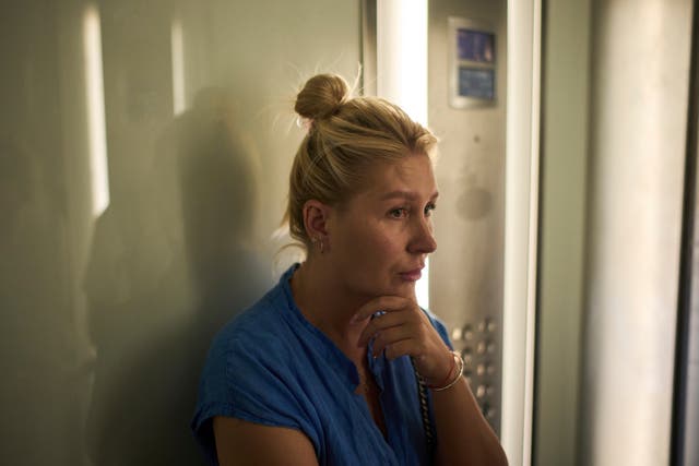 <p>Ukrainian makeup artist Tetiana Kurakova, 40, takes the elevator in a hotel in Tel Aviv, Israel, that was turned into a shelter for evacuees from Bat Yam, which was hit by an Iranian strike</p>