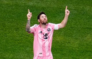 Lionel Messi celebrates after scoring