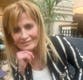 Woman charged with murder of film director in missing Rolex case