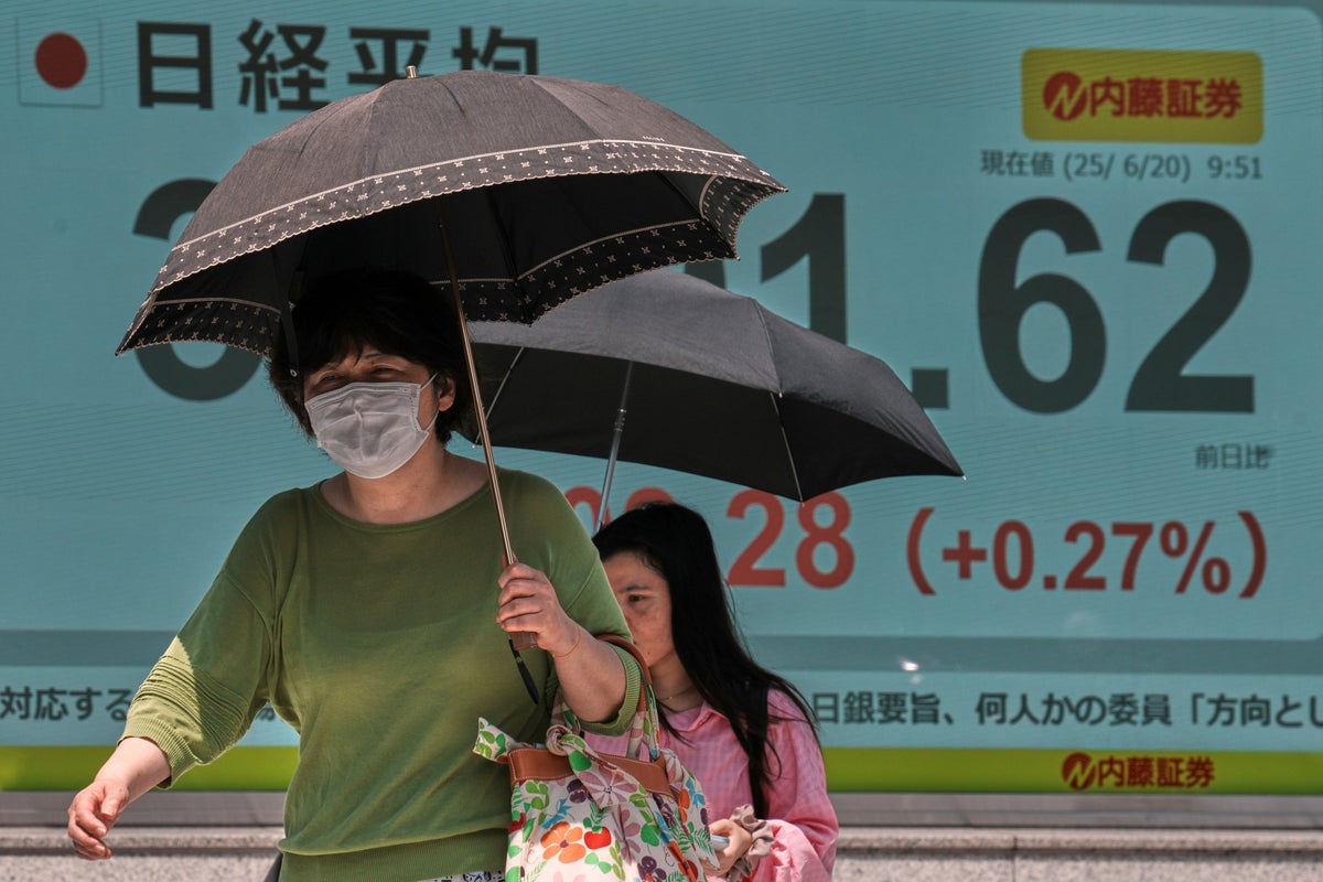 Asian shares are mixed and oil gains as world waits to see if US will join Israel's war against Iran