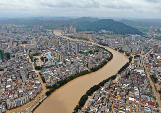 <p>An aerial view shows floodwaters from a river overwhelming towns in Huaiji county of south Guangdong province</p>