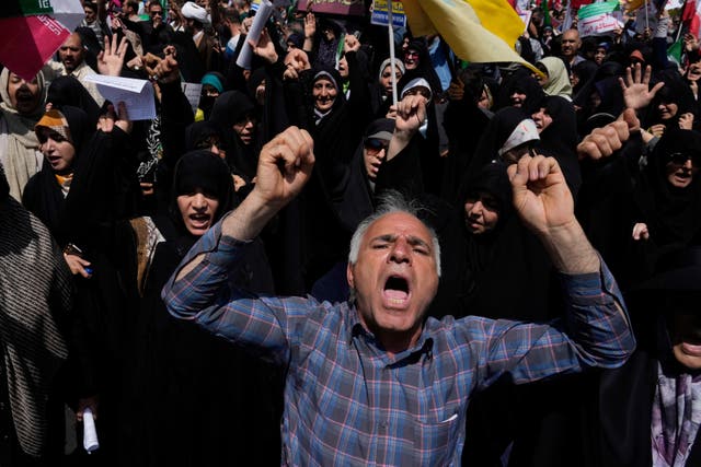 <p>Iranian protesters chant slogans during a protest to condemn Israeli attacks on multiple cities across Iran, after the Friday prayers ceremony in Tehran, Iran, Friday, June 20, 2025. (AP Photo/Vahid Salemi)</p>