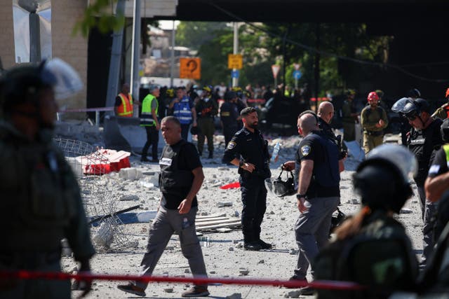 <p>Israeli security forces work at an impact site following Iran’s missile strike on Haifa, Israel</p>