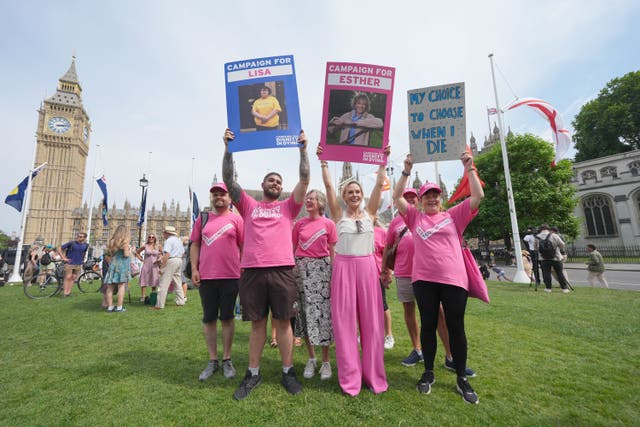 Dame Esther Rantzen’s daughter Rebecca Wilcox (centre) celebrates with campaigners (Yui Mok/PA)