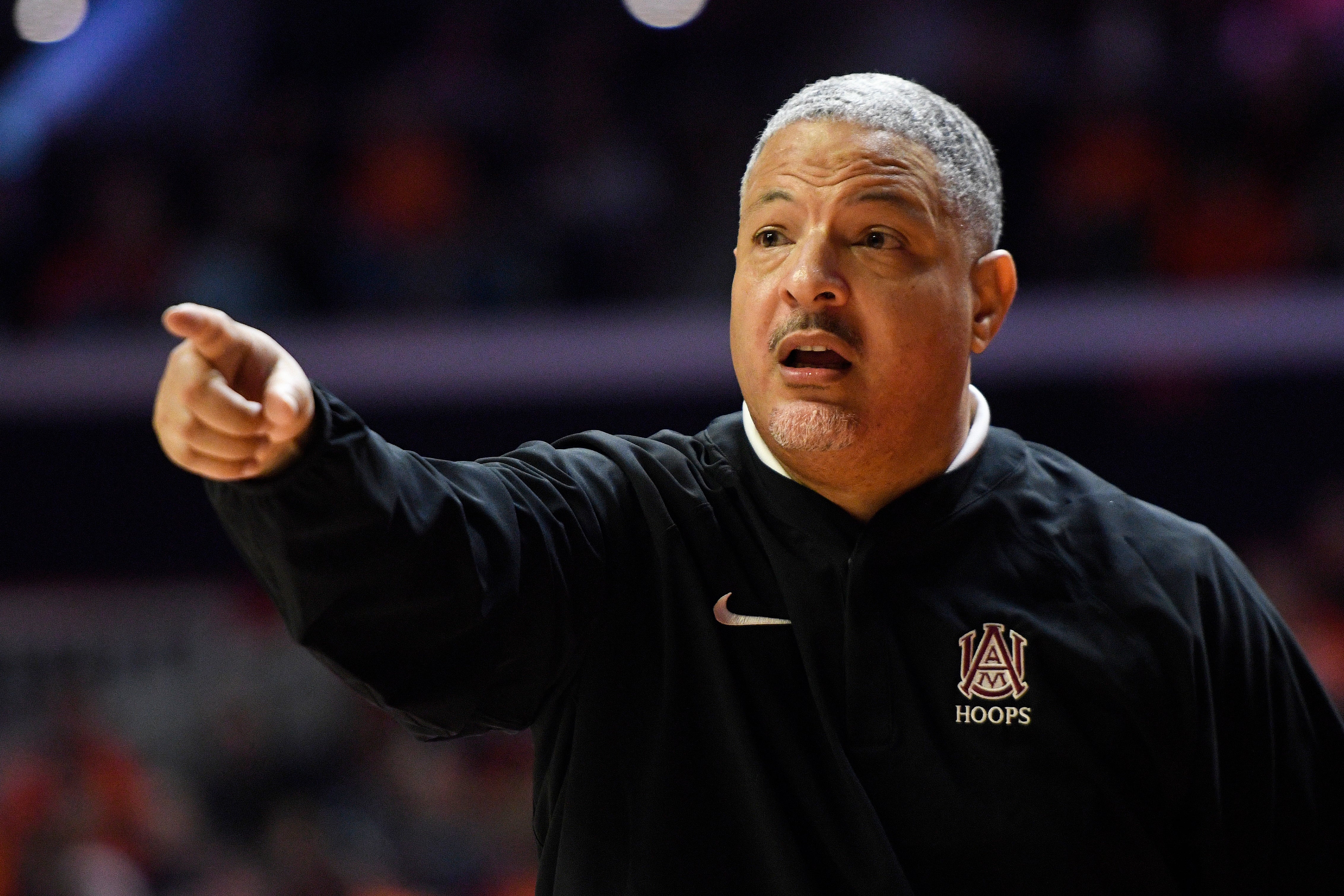 Former Alabama A&M head coach Otis Hughley Jr. signals during the second half of an NCAA college basketball game against Illinois on Dec. 17, 2022, in Champaign, Ill. (AP Photo/Michael Allio, File)