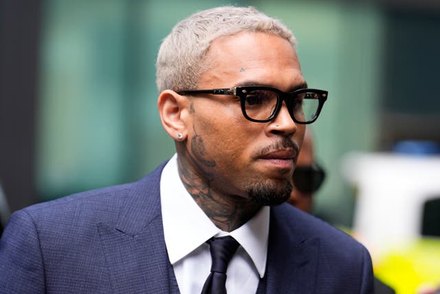 <p>Chris Brown arrives at Southwark Crown Court on Friday</p>