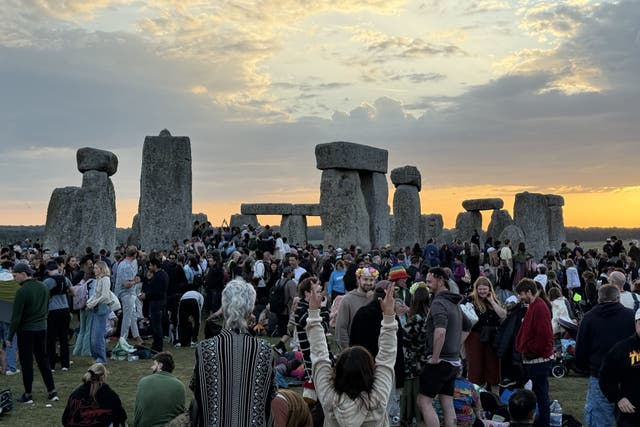 People gather at Stonehenge (PA)
