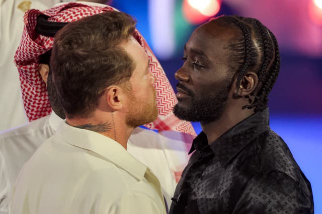 <p>Terence Crawford and Canelo Alvarez face off in the press conference in Riyadh</p>