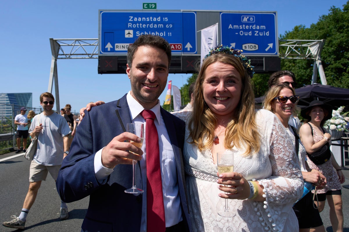 Couples tie the knot during a festival on an Amsterdam ring road