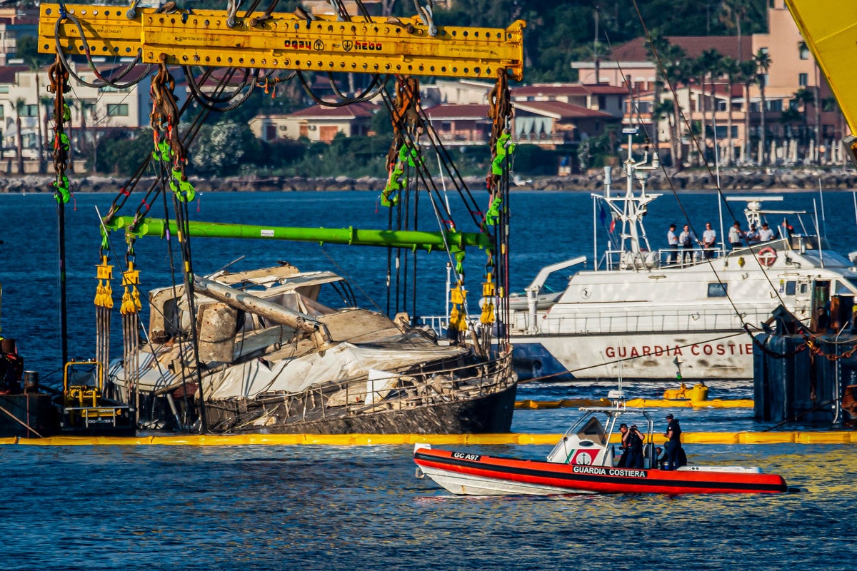 Photos of luxury superyacht that sank off Sicily, killing 7, being lifted from the ocean