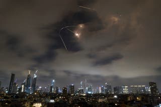 Israeli air defense system fires to intercept missiles during an Iranian attack over Tel Aviv on Saturday
