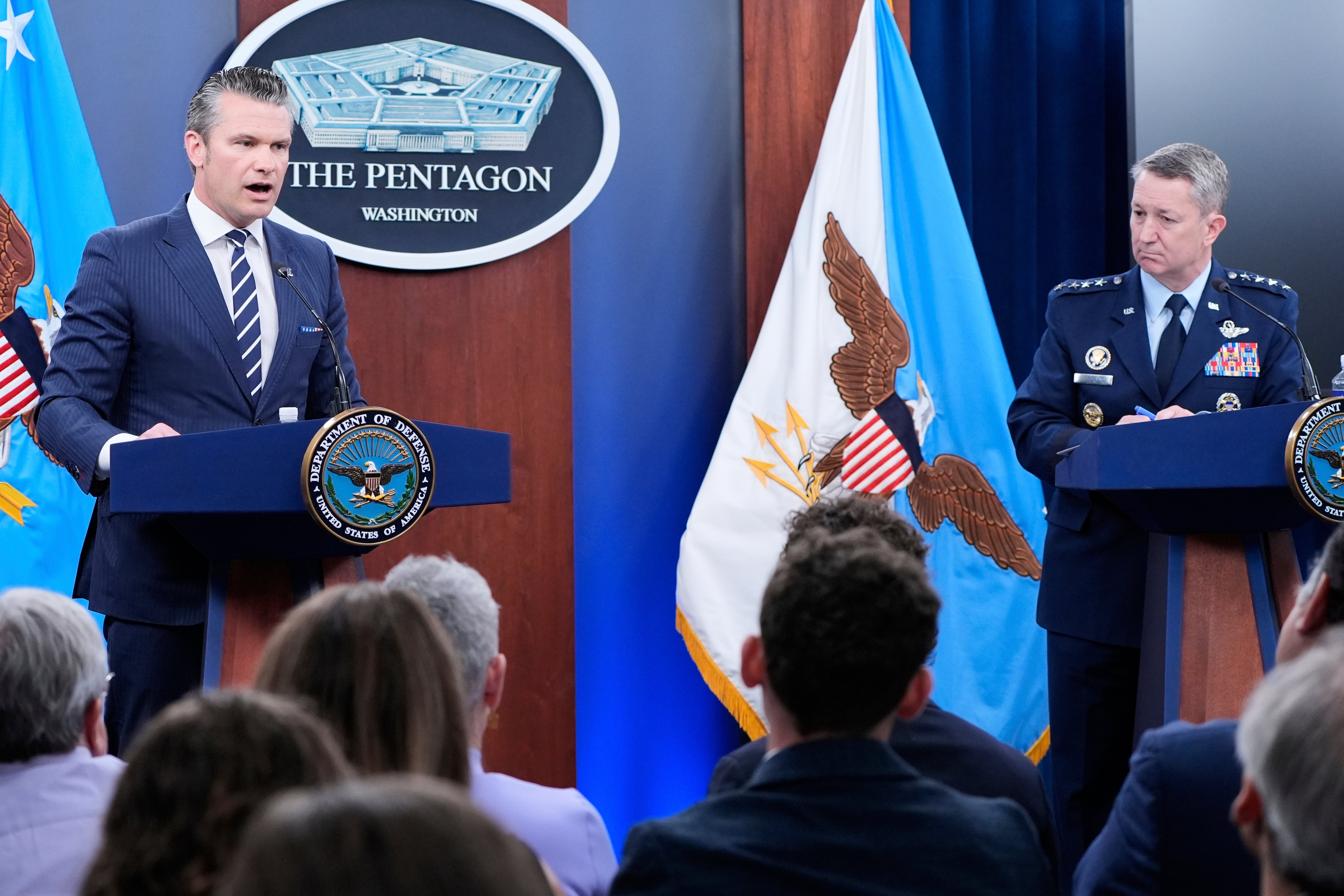 Defense Secretary Pete Hegseth and Joint Chiefs Chairman Gen. Dan Caine speak during a news conference Sunday at the Pentagon after the U.S. military struck three sites in Iran, directly joining Israel's effort to destroy the country's nuclear program.