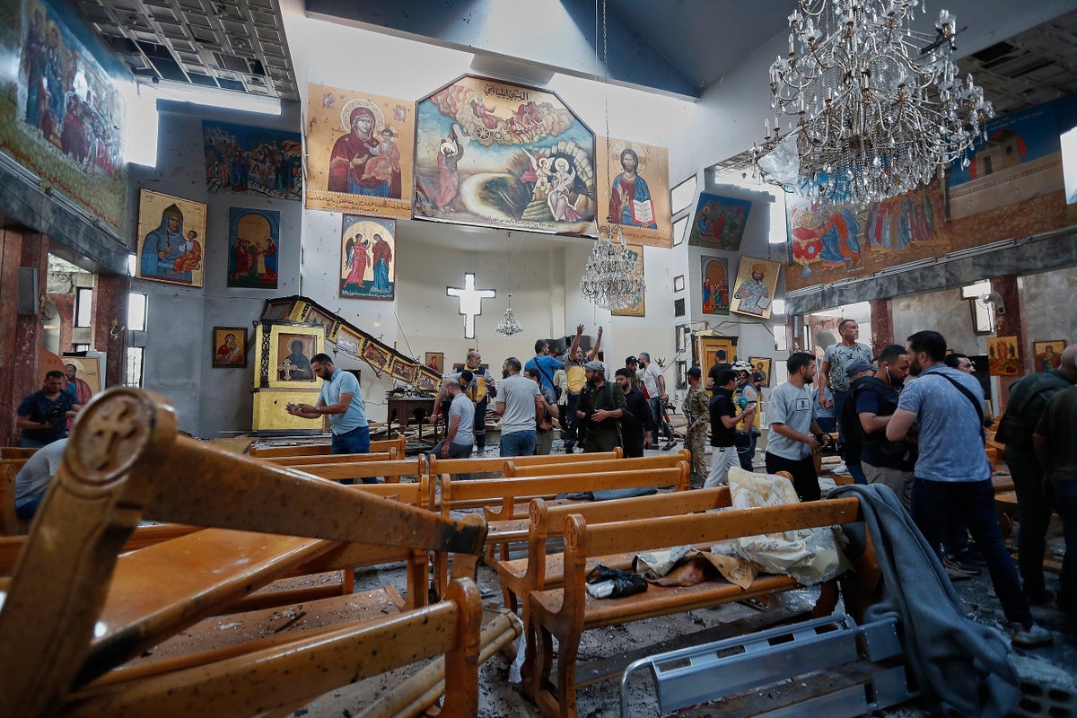 Suicide bomber kills at least 22 in packed Syrian church near Damascus
