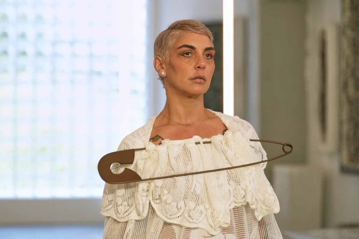 Simon Cracker creates a brand uniform to highlight star upcycled garments during Milan Fashion Week
