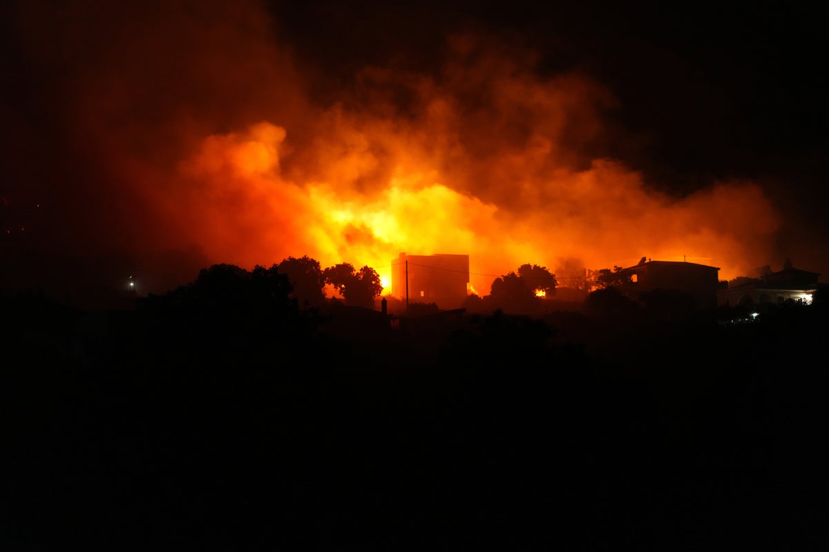Greece wildfires: Dozens evacuated as flames ravage holiday island