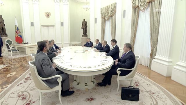 <p>Russian president Vladimir Putin and Iranian foreign minister Abbas Araghchi attend a meeting in Moscow</p>