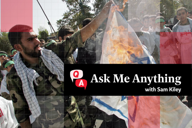 <p>A member of Iran’s Revolutionary Guards burns an Israeli flag during a demonstration held in Tehran to mark Jerusalem (Al-Quds) Day
</p>