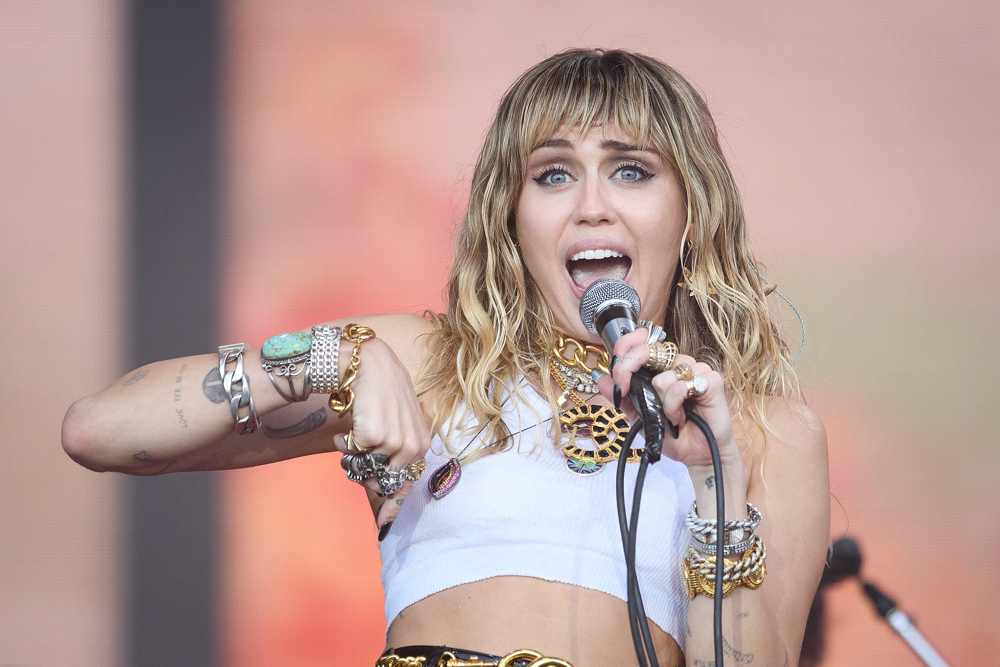 Miley Cyrus wore a cropped white vest for her performance at Glastonbury in 2019