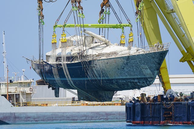 Mike Lynch’s superyacht the Bayesian is moved after being lifted to the surface near the fishing town of Porticello, Sicily (Peter Byrne/PA)