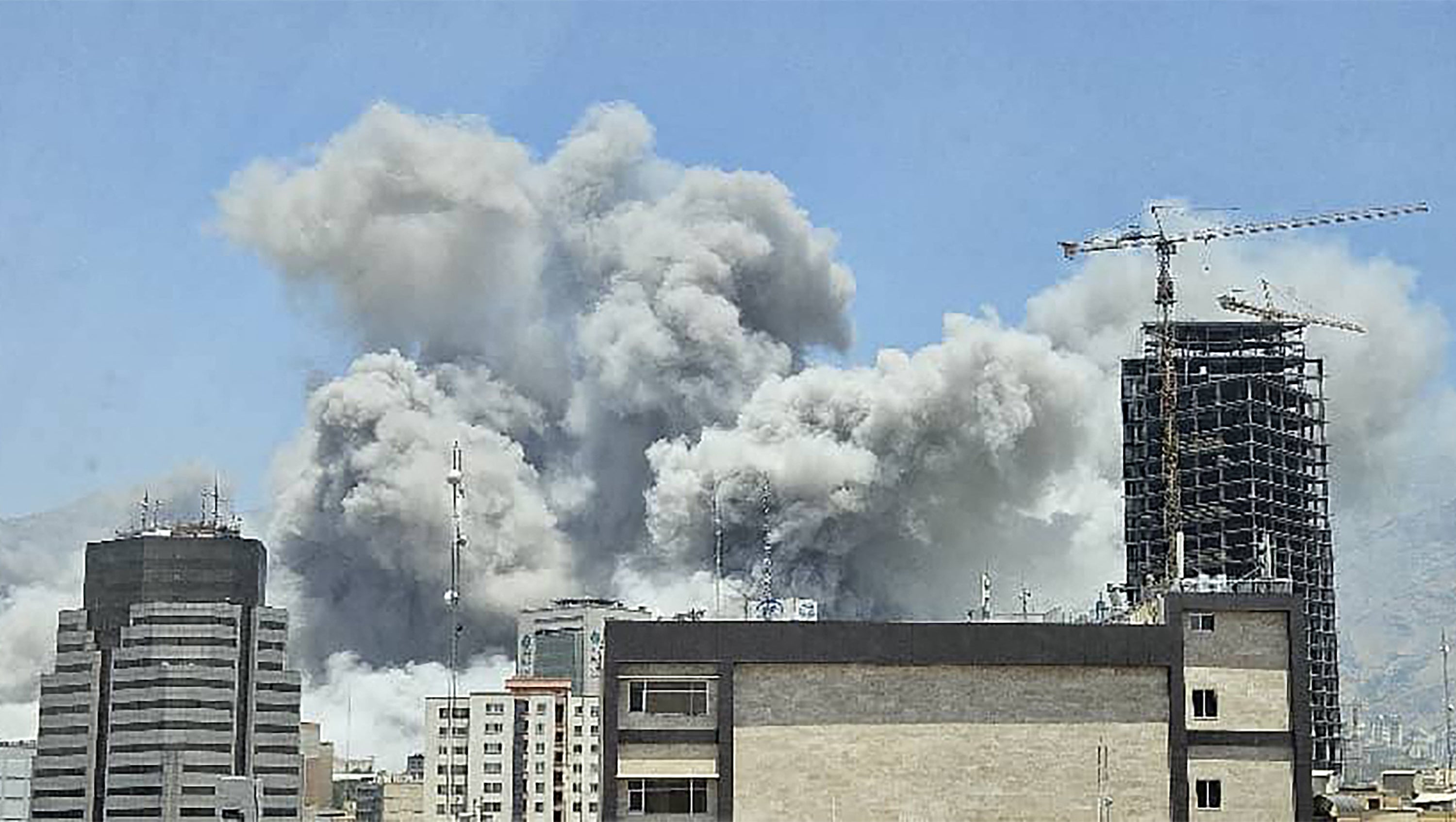 A plume of smoke billowing after Israeli strikes in Tehran. Israel said it struck Iran Revolutionary Guards sites in Tehran and the city's notorious Evin prison on June 23, instensifying its attacks a day after the United States hit the Islamic republic's nuclear facilities