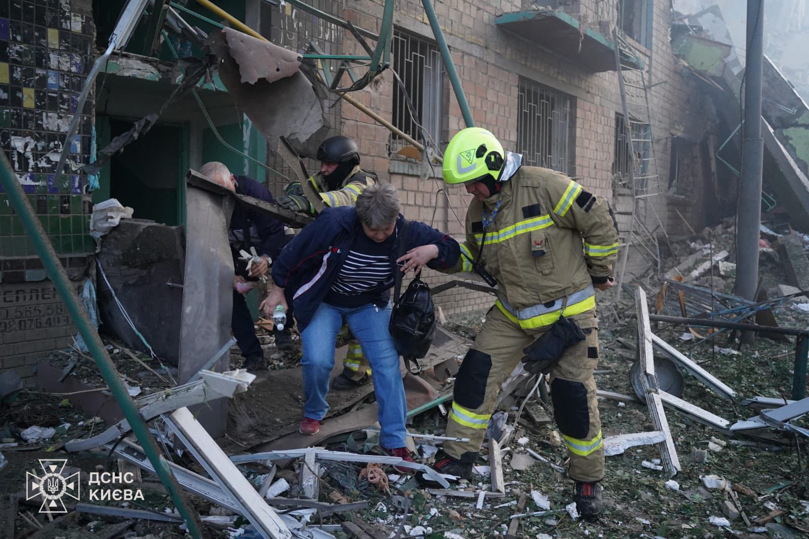 Rescuers evacuating local residents from the damaged building following night Russian drone and missile strikes in Kyiv, amid Russian invasion in Ukraine