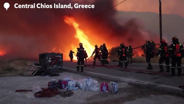 <p>Wildfires ravage Greek holiday island as fire crews battle blazes and dozens evacuated.</p>