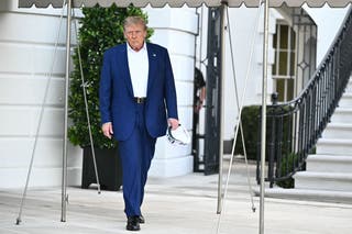 Trump approaches reporters as he walks to board Marine One