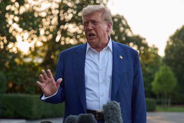 <p>President Donald Trump speaks with reporters before boarding Marine One on the South Lawn of the White House</p>