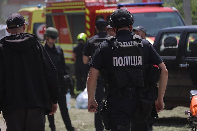 <p>Emergency services at work following a Russian missile strike in the eastern Ukrainian city of Dnipro</p>