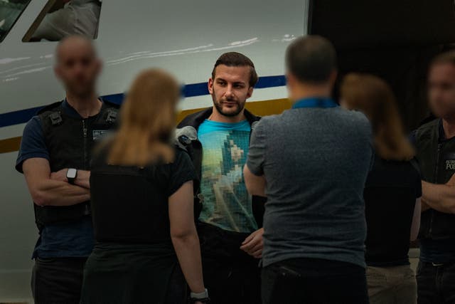 <p>James Harding being arrested by officers from the Metropolitan Police following his extradition from Switzerland</p>