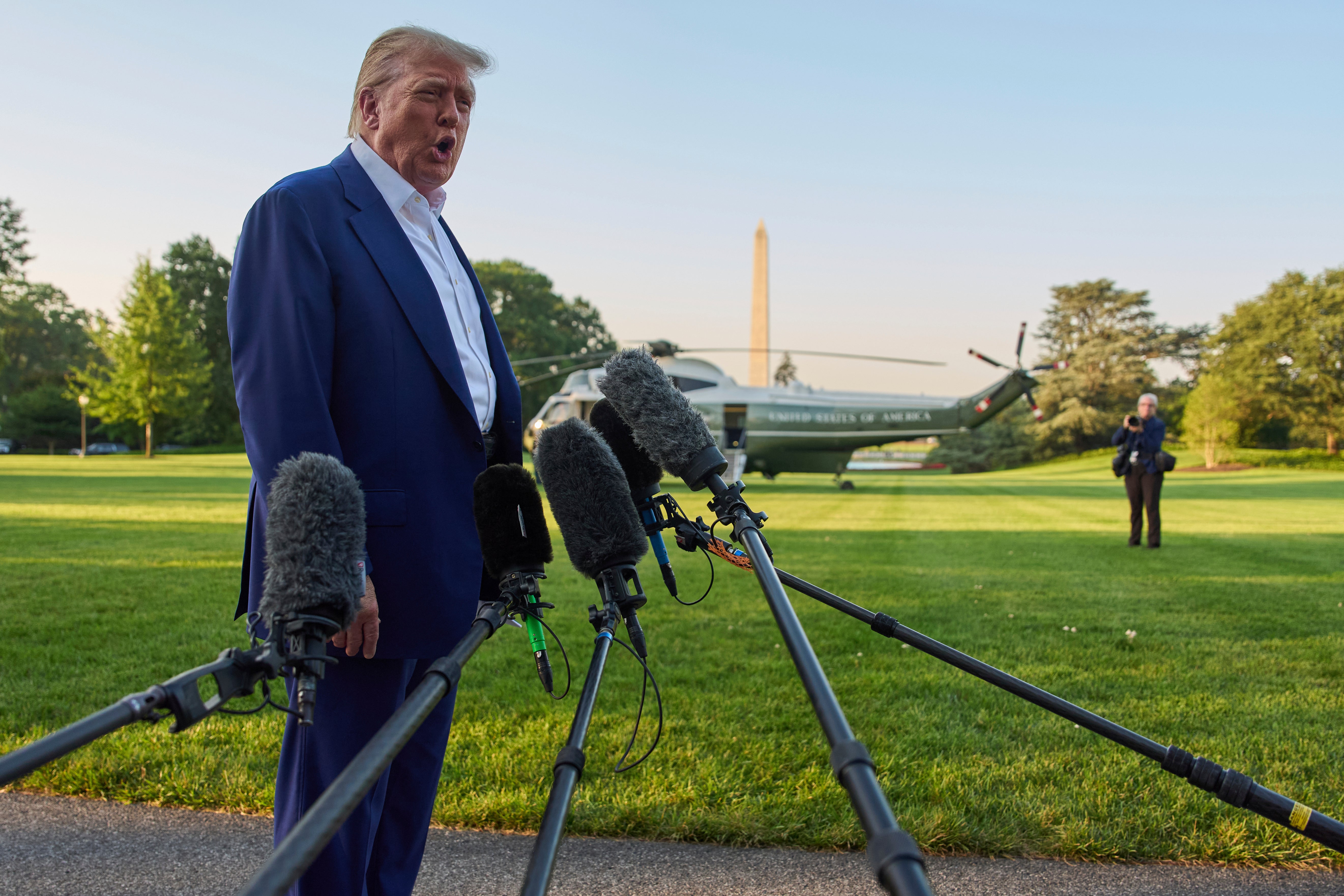 President Donald Trump speaks with reporters before boarding Marine One on the South Lawn of the White House, Tuesday, June 24, 2025, in Washington
