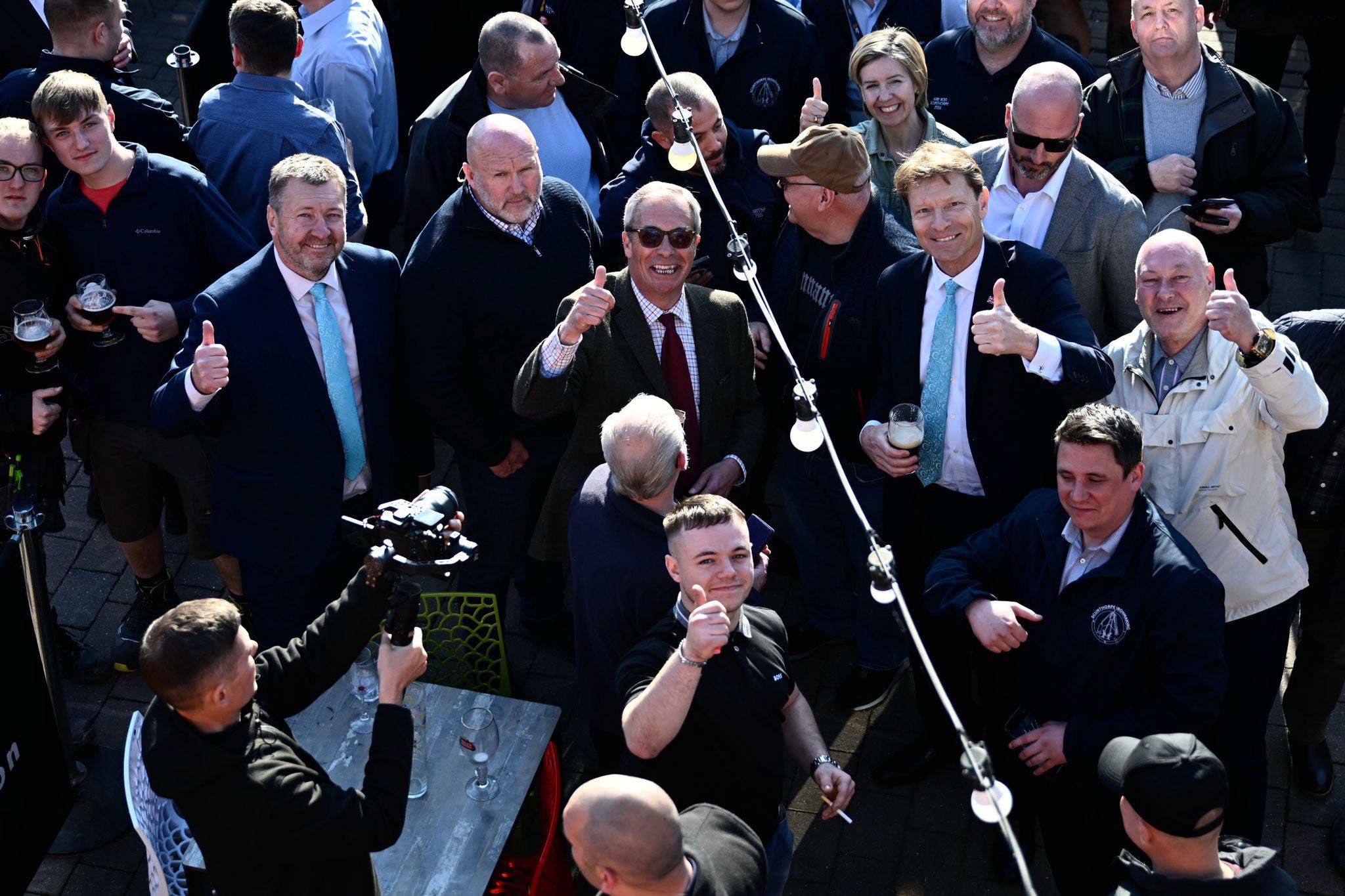 The Reform leader pictured with supporters in Scunthorpe, Lincolnshire earlier this year