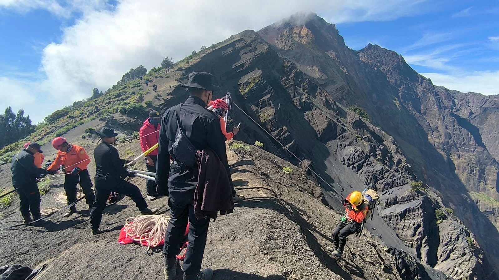 Rescuers preparing a drone to use in a rescue operation for a Brazilian tourist who fell while hiking Mount Rinjani, Lombok Island, Indonesia