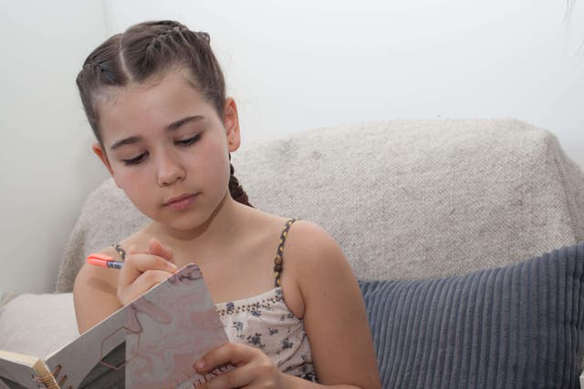 Only one in 10 children said they write daily in their free time (Alamy/PA)