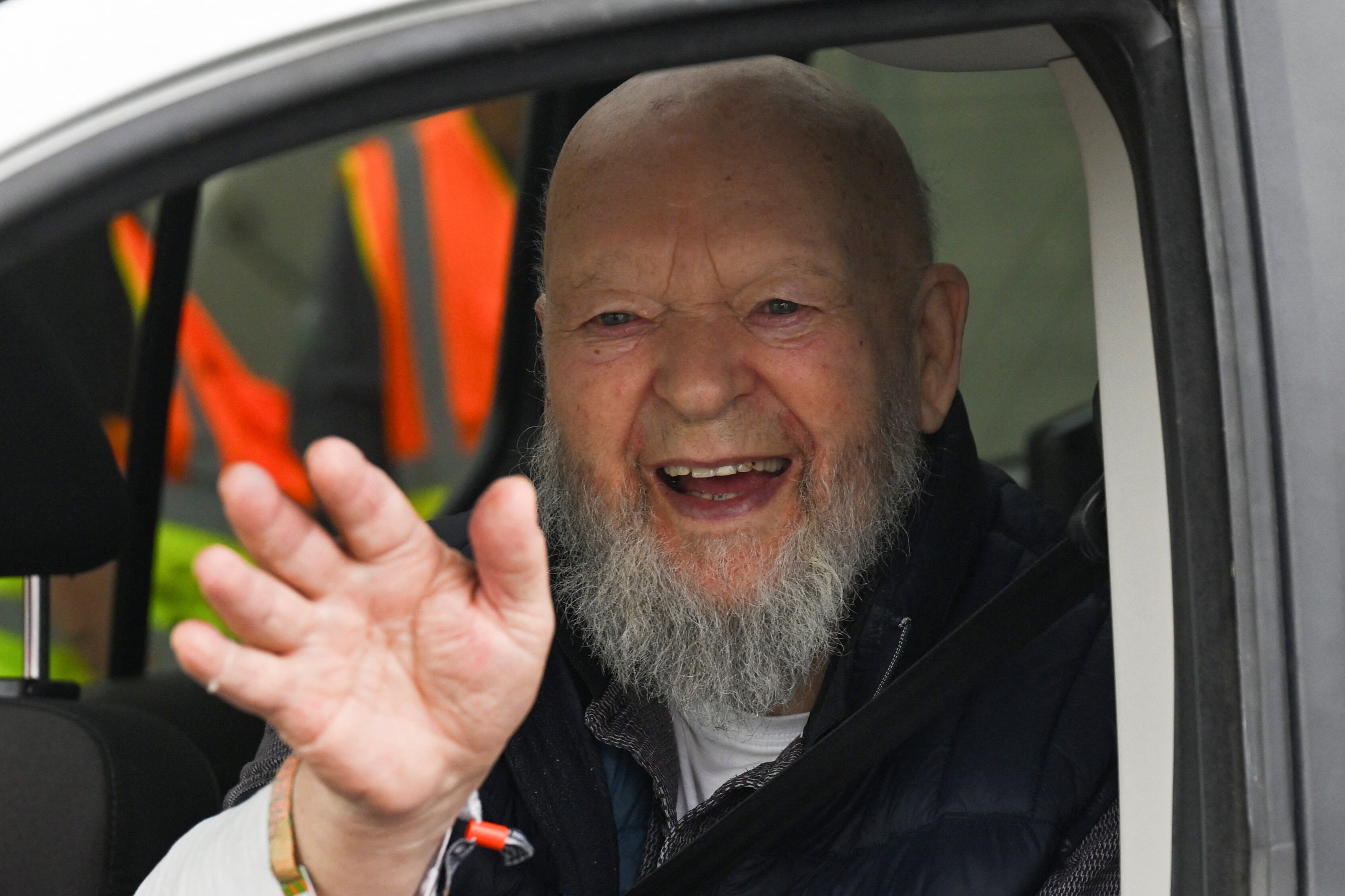 <p>Glastonbury Founder Michael Eavis waves from a vehicle after the gate opening for the Glastonbury Festival at Worthy Farm in Pilton</p>
