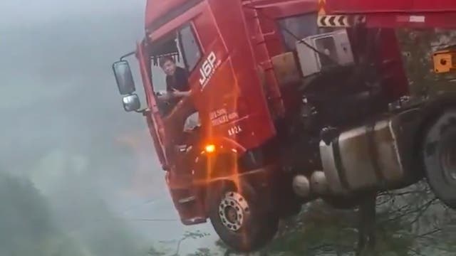 Truck dangles over edge after massive China bridge collapse