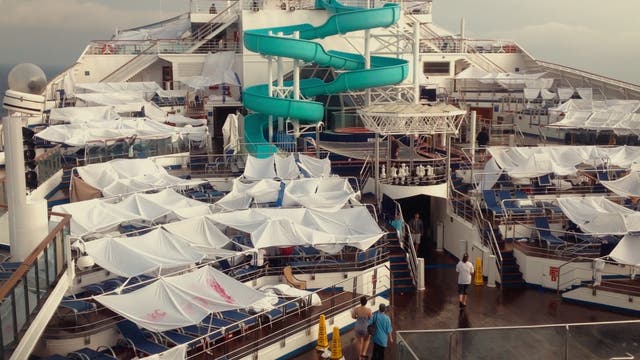 <p>Passengers built makeshift shelters on the deck of the blighted ship</p>