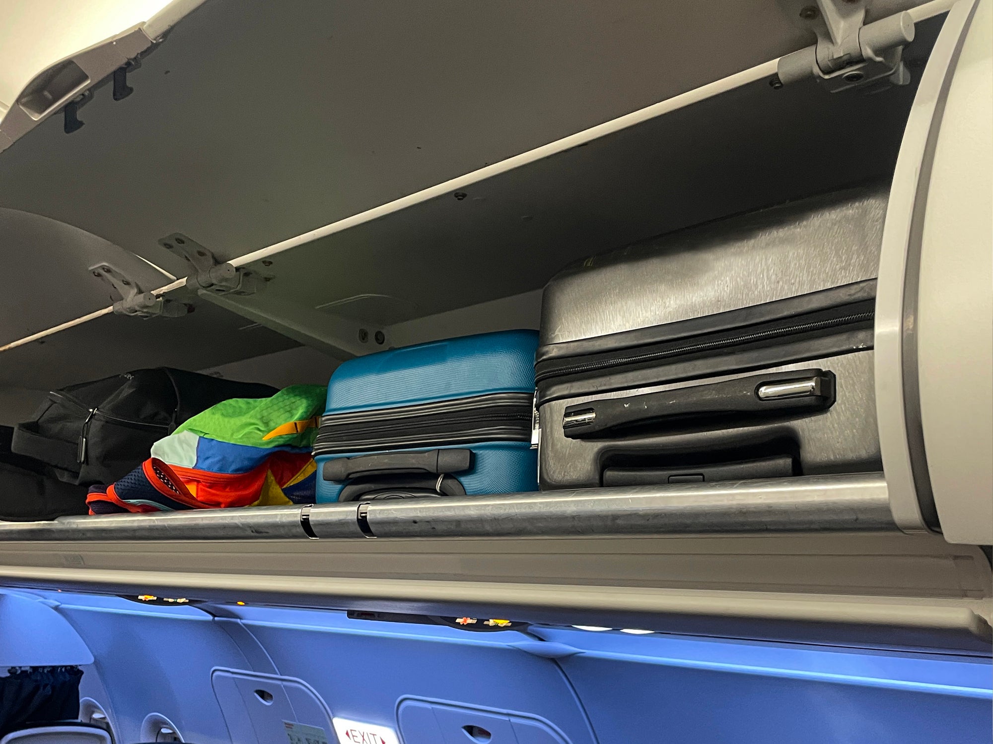 Place bags in overhead bins with the wheels or handles facing out, says travel consultant Sandra Zo Awodele