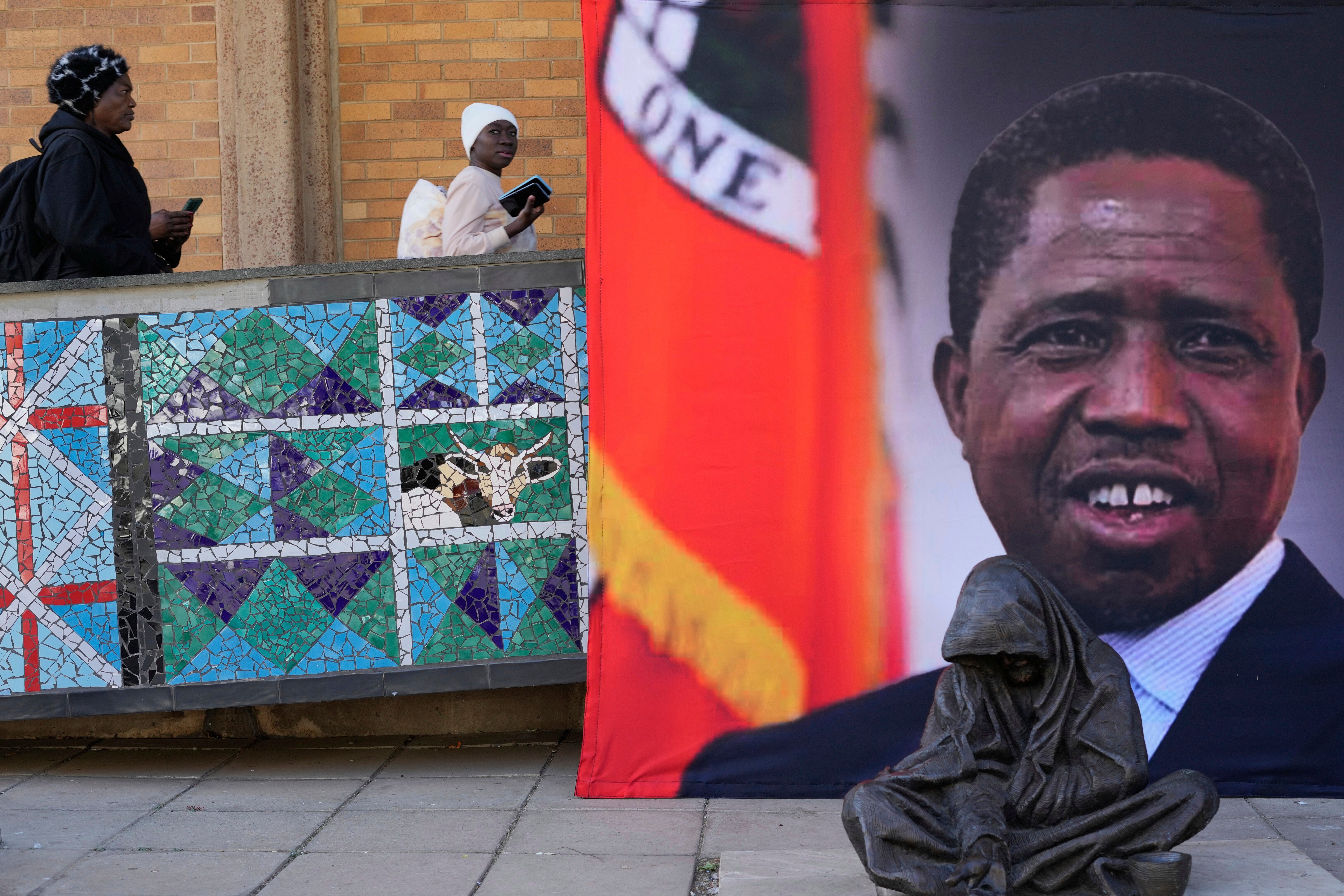 Mourners arrive to attend a Mass for former Zambian President Edgar Lungu
