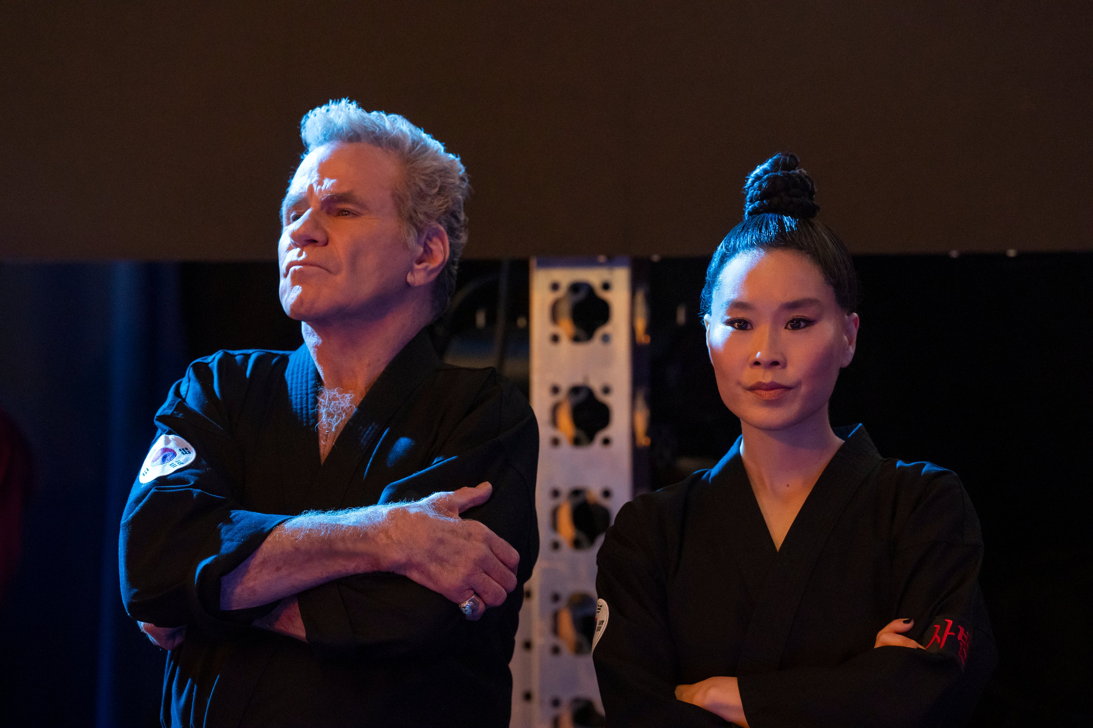 Martin Kove (left) has said he 'deeply regrets' his behavior toward co-star Alicia Hannah-Kim (right)