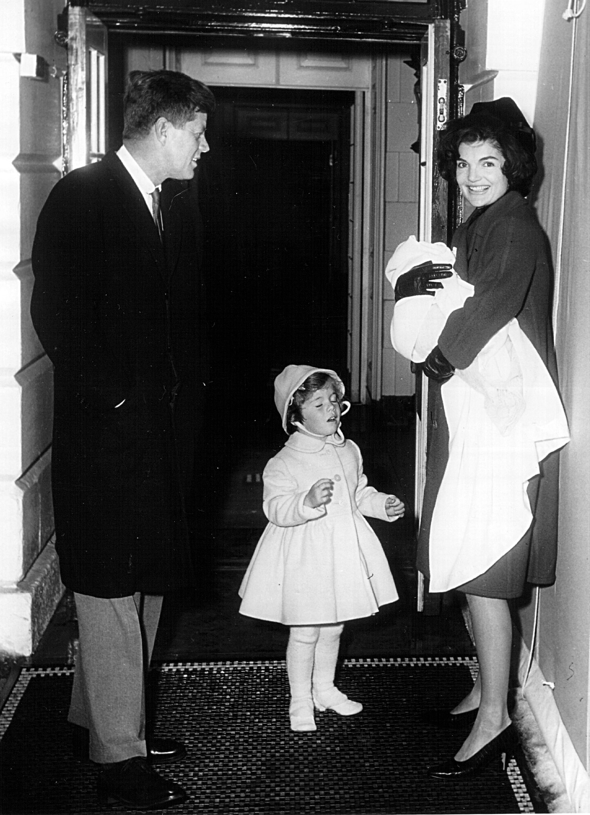 The President and Mrs. Kennedy arrive at the White House February 4, 1961 with their children Caroline and John Jr