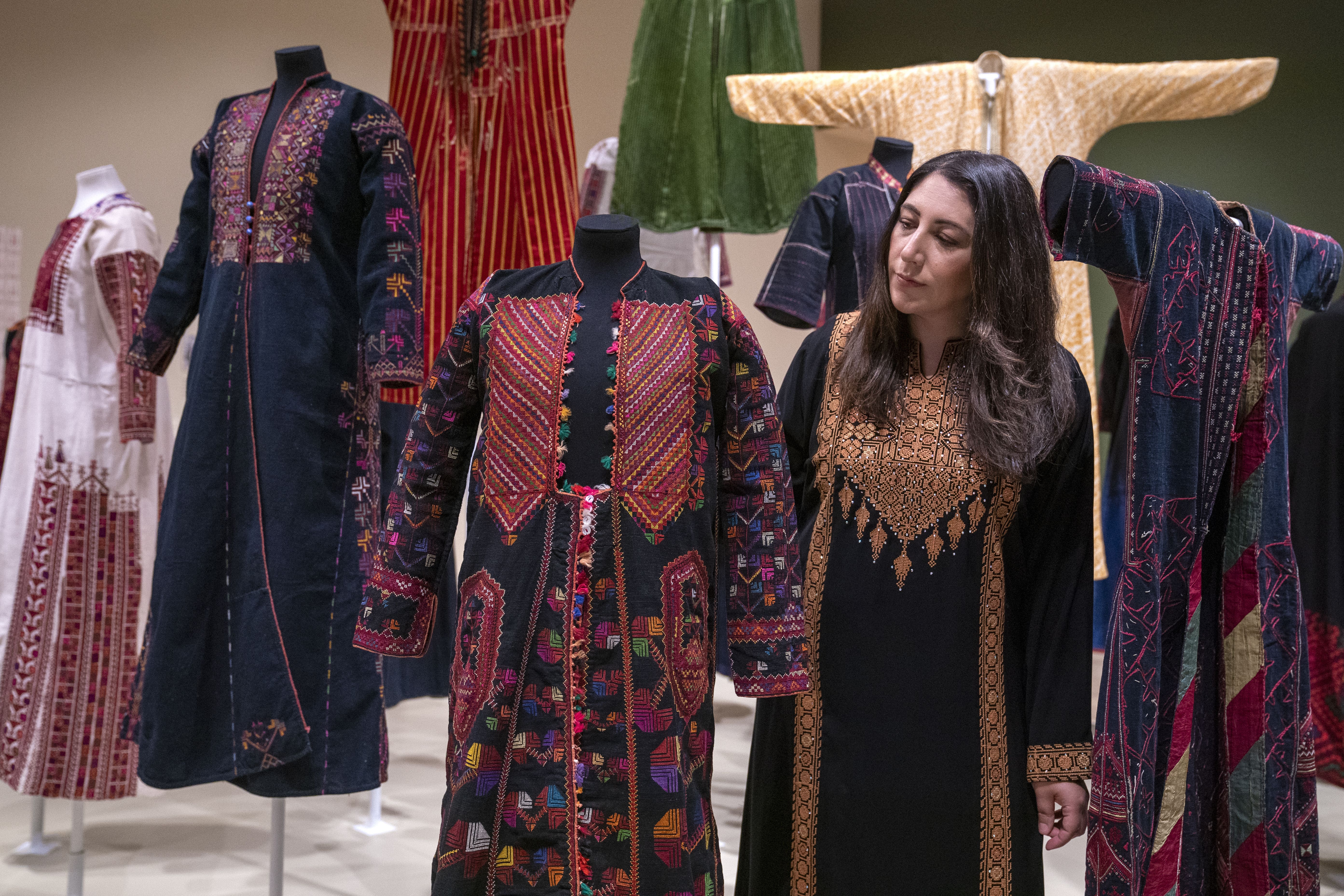 Nadia El-Nakla, a Palestinian-Scottish Dundee councillor, views some of the exhibits (Jane Barlow/PA)