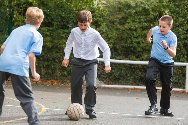 <p>Boys playing football</p>